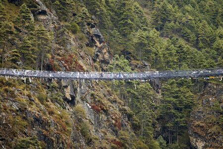 The famous Hillary suspension bridge between Monjo and Namche Bazaar, Everest region, Nepal, Sagarmatha National Parkの写真素材