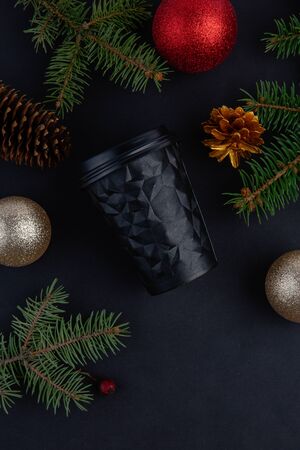 New Year and Christmas festive background for coffee store. Top view on Coffee cup, silver and gold deco baubles and Christmas tree. Image for the festive season and sales. Coffee shop conceptの写真素材