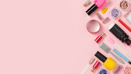 Nail care. A set of professional tools for manicure and pedicure. Beauty care. Coating nails with gel polish. Tools for creating and for the treatment of nails. Salon Banner Pink Backgroundの写真素材
