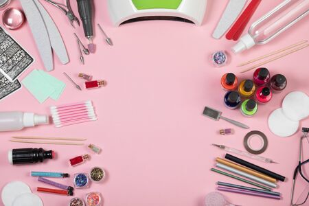 Nail care. A set of professional tools for manicure and pedicure. Beauty care. Coating nails with gel polish. Tools for creating and for the treatment of nails. Salon Banner Pink Backgroundの写真素材