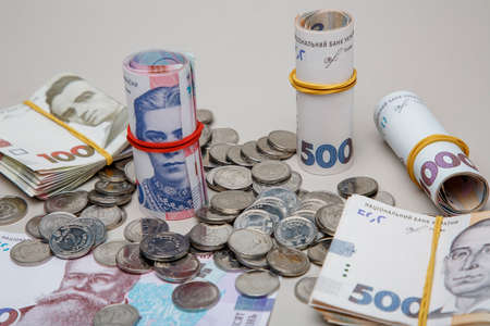Background from banknotes and coins of the hryvnia. Ukrainian money. A bill in one thousand hryvnia, five hundred and two hundred hryvnia and twenty hryvnia and coins in one, two and five hryvnias.のeditorial素材