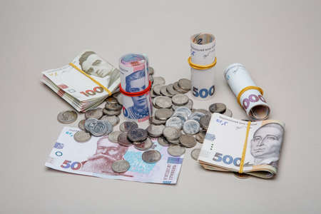 Background from banknotes and coins of the hryvnia. Ukrainian money. A bill in one thousand hryvnia, five hundred and two hundred hryvnia and twenty hryvnia and coins in one, two and five hryvnias.のeditorial素材