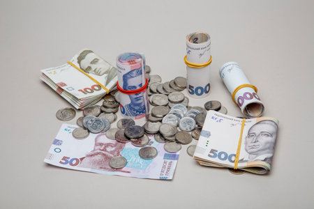 Background from banknotes and coins of the hryvnia. Ukrainian money. A bill in one thousand hryvnia, five hundred and two hundred hryvnia and twenty hryvnia and coins in one, two and five hryvnias.の写真素材