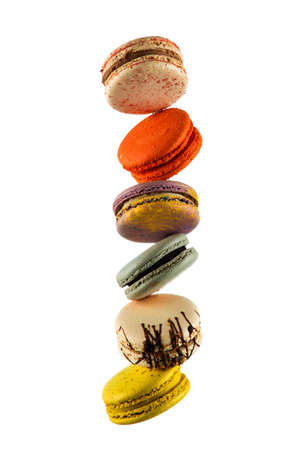 Set of flying colorful macaroons isolated on black background Macaron or macaroon cakes hang in the air. Sweet and colorful dessert Copy Space Colored levitates French cookiesの写真素材