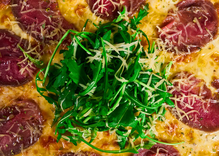 Italian pizza with beef close-upの写真素材