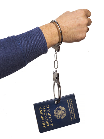 Belarusian passport in handcuffsの写真素材