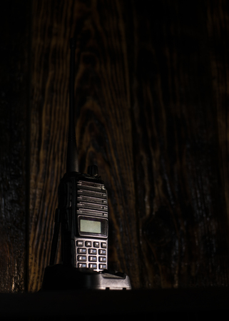 hand-held transceiver on the tableの写真素材