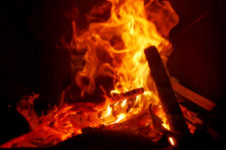 background with a burning flame in the fireplace