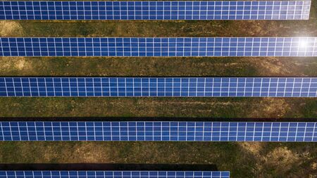 Aerial shot top view of solar panel photovoltaic farmの写真素材