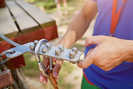 climbing equipment in the hands of the instructor close-up