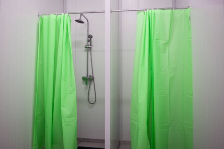 showers with green curtains at the enterpriseの写真素材