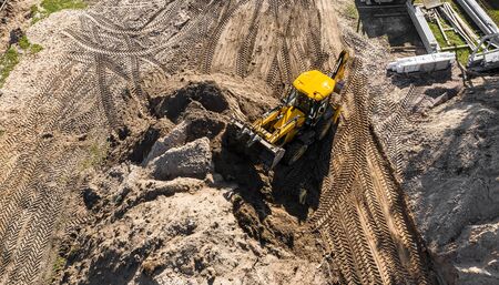 excavator working on a construction site top view