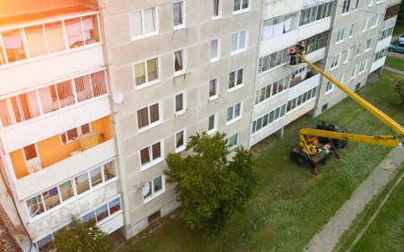 repair of the facade of a multi storey building using a tower crane