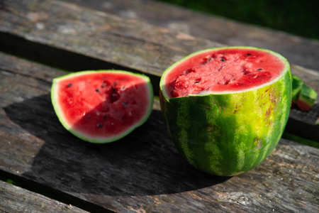 watermelon cut into two parts at a picnic.の写真素材