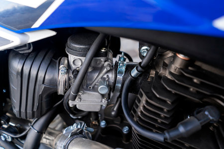 Enduro motorcycle exhaust system close-up.