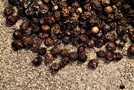 Grains of black pepper on a sackingの写真素材