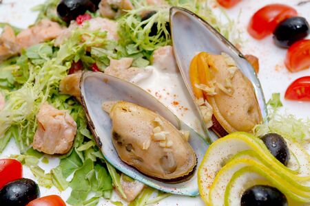 Salad from a mussel with fish and vegetablesの写真素材