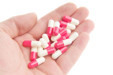 Red-white pills on a white background