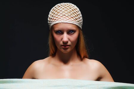 The young woman on a dark backgroundの写真素材