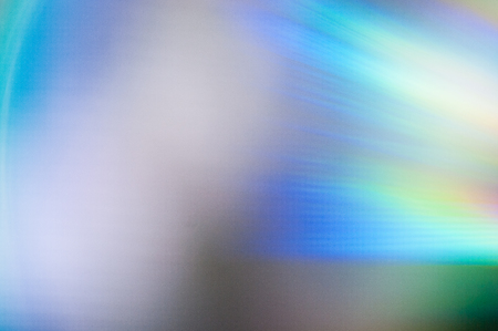 Refraction of light rays on the surface of the CD. Colored rays.