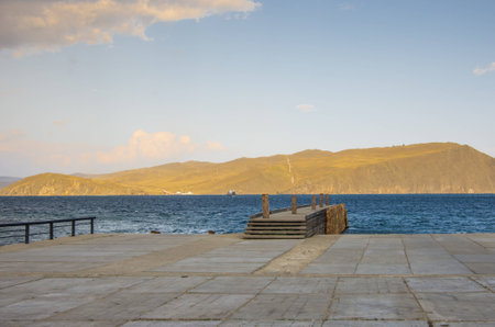 Pier on Lake Baikal on the background of Olkhon Islandの写真素材