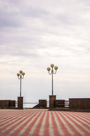 Tone pavement tiles and lanterns on the river embankment