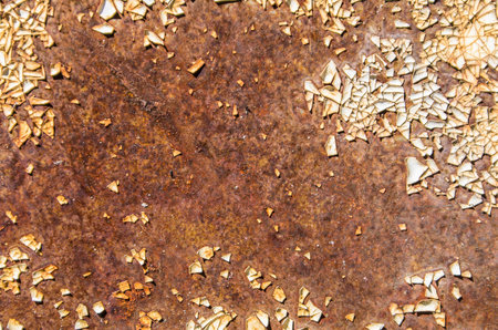 Rust and white paint residue on metal surface