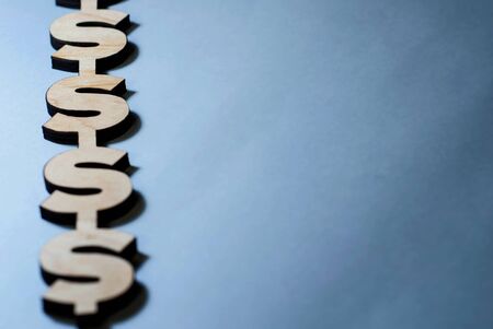 dollar signs lie on a blue background, background for slides, business sitesの写真素材