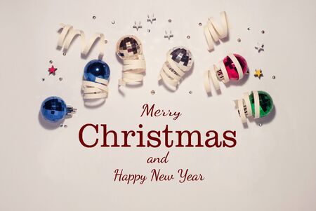 Christmas composition, Christmas toys in a circle, white cute background, place for text, top view, congratulations on Christmas and New Yearの写真素材