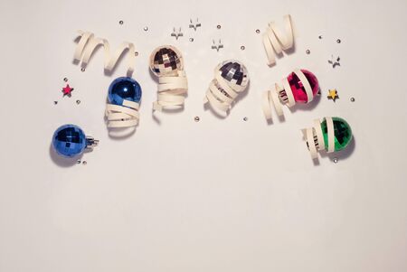 Christmas composition, Christmas toys in a circle, white cute background, place for text, top view, congratulations on Christmas and New Yearの写真素材