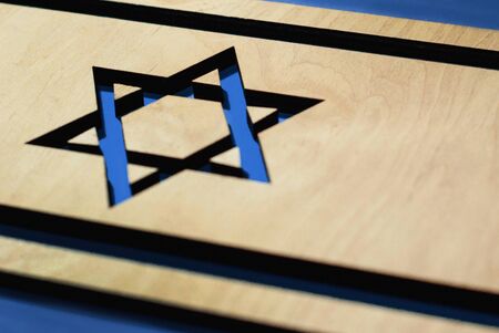 flag of Great Britain, carved from wood on a blue background, designの写真素材