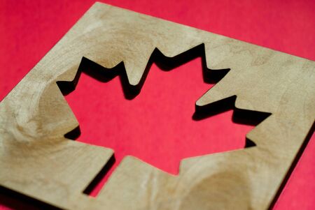 flag canada, maple leaf carved from wood, red background, background, illustrationの写真素材