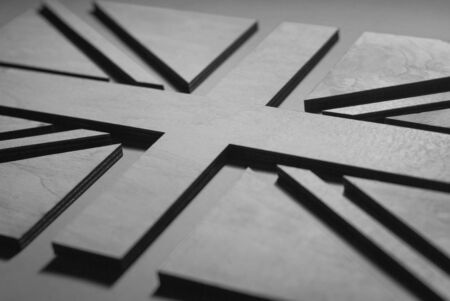 the flag of the UK is close, made of wood in beautiful gray tones, stylish designの写真素材