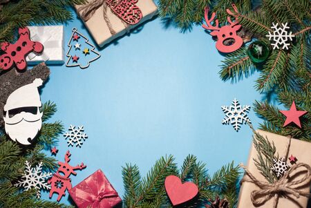 Christmas and New Year composition. Christmas tree branches and gifts around the place for text, your text and a place for congratulationsの写真素材