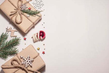 Christmas composition. Christmas gifts, Christmas tree branches, pinecone, toys on a white background. Place for text, design for postcard, view from topの写真素材