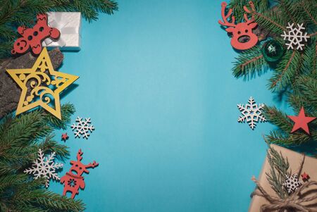 Christmas background composition, place for text, gifts branches wooden snowflakes and stars, design, top viewの写真素材