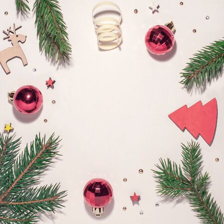 Christmas composition. Christmas tree branches and Christmas toys, a white background and space for text. view from topの写真素材