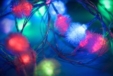 christmas lights close dark backgroundの写真素材
