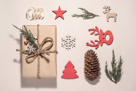 Christmas composition. Christmas gifts, Christmas tree branches, pinecone, toys on a white background. Flat, view from top.の写真素材