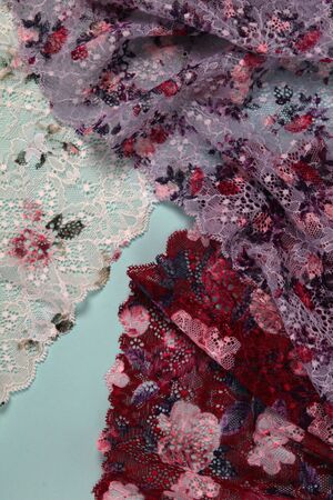 Abstract background with pile of color rich bright lace for Lingerie, panties, and bras. Delicate...