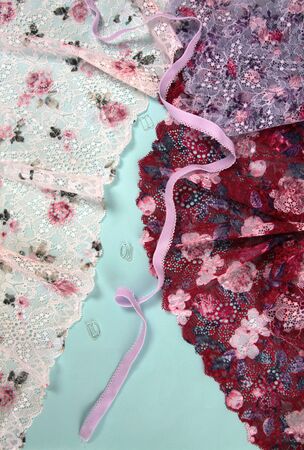Abstract background with pile of color rich bright lace for Lingerie, panties, and bras. Delicate sophisticated glamorous elastic material. Using for Atelier and fabric store.の写真素材