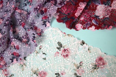 Abstract background with pile of color rich bright lace for Lingerie, panties, and bras. Delicate sophisticated glamorous elastic material. Using for Atelier and fabric store.の写真素材