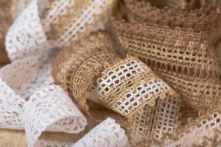 knitted openwork linen ribbon tapes in rural style of rustics cotton eco natural, use for storeの写真素材