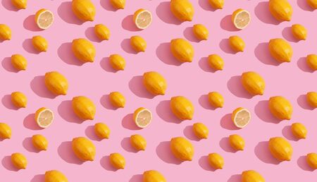Trendy isometric Seamless continuous pattern of yellow lemons on pink background. Minimalist concept of fresh citrus fruitの写真素材