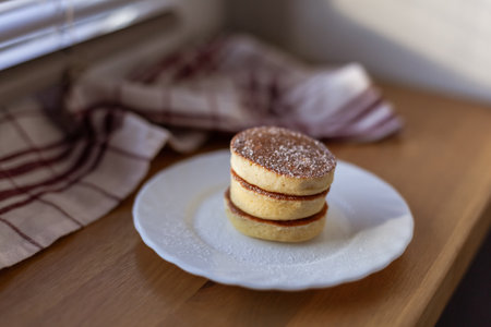 Homemade Fluffy Souffle Pancake, dough made from almond, coconut, soy protein flour, closeup, on...
