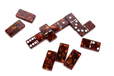 Amber Domino Yellow Orange tiles on white Backgound. Board table game Concept. Copy space for text.の写真素材