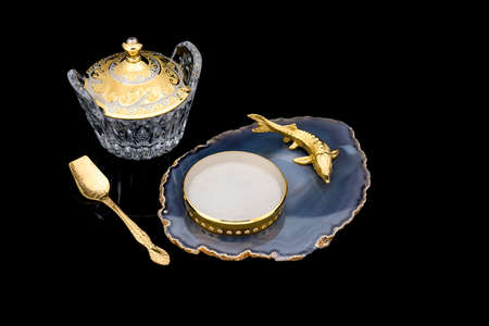 Gilded luxury crystal caviar bowl on stand made of natural quartz, carved brass fish figurine and...