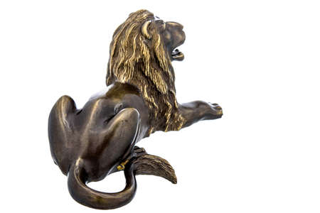 Lion Vintage Antique grunge bronze brass figurine statue of beautiful animal, isolated on white background. Decoration Sculpture for interior. Copy Space for Text. Close up selective soft focus.の写真素材