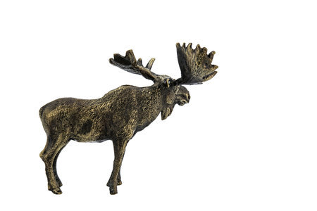 Horned elk, deer Vintage Antique grunge bronze brass figurine statue of beautiful animal, isolated on white background. Decoration Sculpture for interior. Close up Selective soft focus.の写真素材