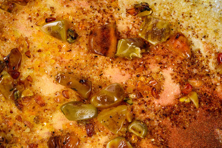 Multi colored granite Texture Mosaic of Natural gemstone Spilled amber in contour sunlight as...